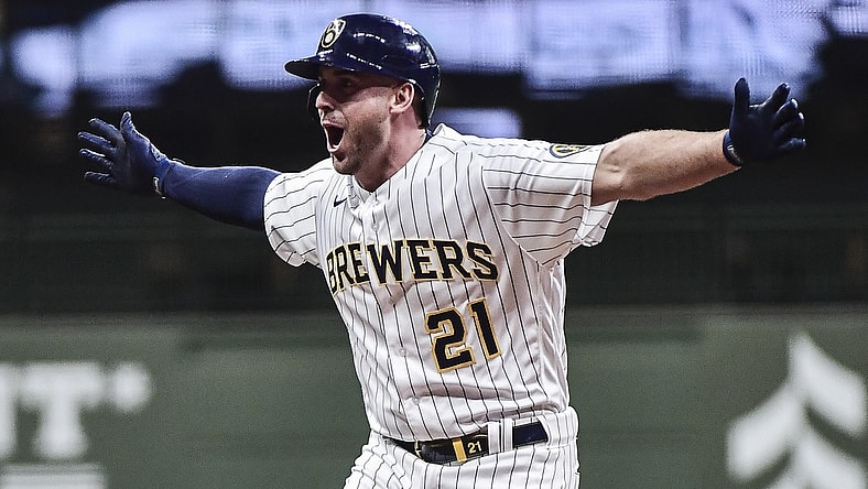 May 1, 2021; Milwaukee, Wisconsin, USA;  Milwaukee Brewers third baseman Travis Shaw (21) reacts after driving in the winning run with a base hit in the eleventh inning against the Los Angeles Dodgers at American Family Field. Mandatory Credit: Benny Sieu-USA TODAY Sports