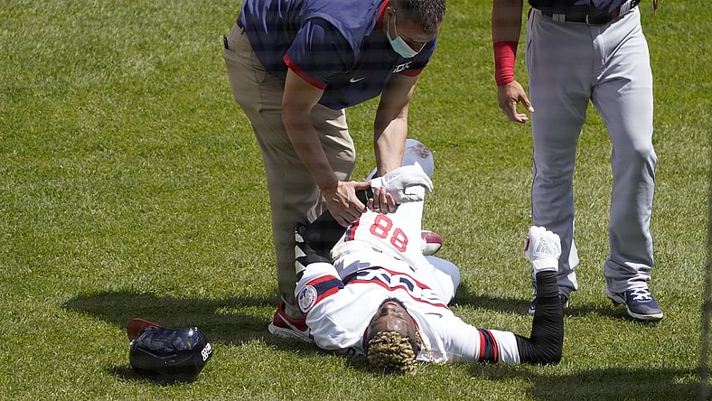 May 2, 2021; Chicago, Illinois, USA; Chicago White Sox center fielder Luis Robert (88) is hurt after beating out an infield single against the Cleveland Indians during the first inning at Guaranteed Rate Field. Mandatory Credit: David Banks-USA TODAY Sports
