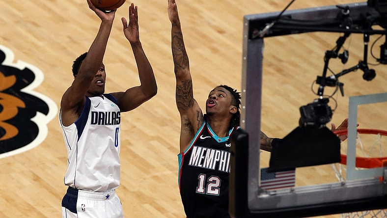 May 11, 2021; Memphis, Tennessee, USA; Dallas Mavericks guard Josh Richardson (0) shoot over Memphis Grizzlies guard Ja Morant (12) during the third quarter at FedExForum. Mandatory Credit: Petre Thomas-USA TODAY Sports