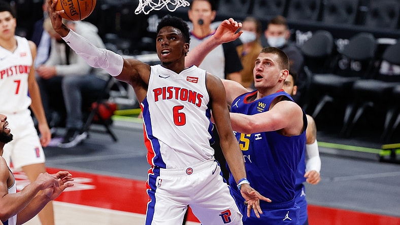 May 14, 2021; Detroit, Michigan, USA; Detroit Pistons guard Hamidou Diallo (6) goes to the basket on Denver Nuggets center Nikola Jokic (15) in the first half at Little Caesars Arena. Mandatory Credit: Rick Osentoski-USA TODAY Sports