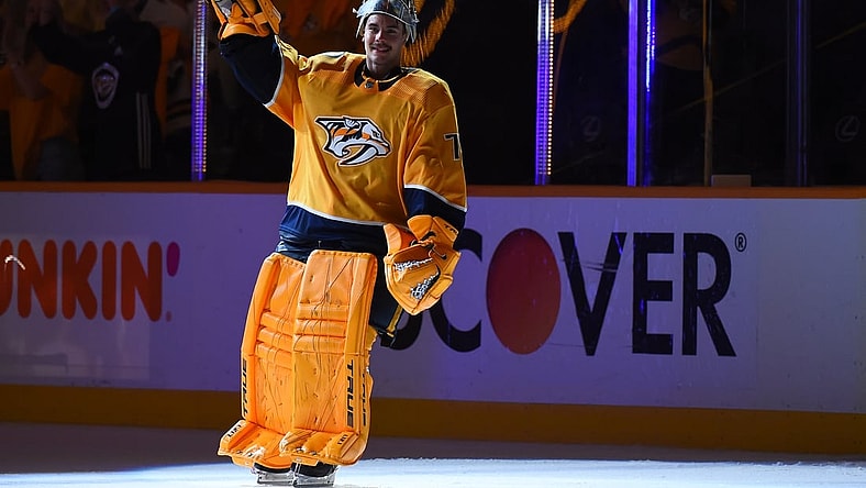 May 21, 2021; Nashville, Tennessee, USA; Nashville Predators goaltender Juuse Saros (74) waives to the crowd after being named the third star of the game after a double overtime win against the Carolina Hurricanes in game three of the first round of the 2021 Stanley Cup Playoffs at Bridgestone Arena. Mandatory Credit: Christopher Hanewinckel-USA TODAY Sports
