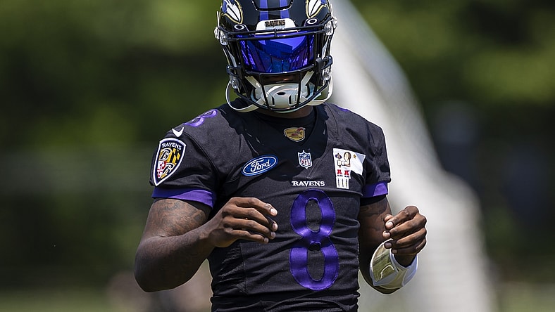 May 26, 2021; Owings Mills, Maryland, USA; Baltimore Ravens quarterback Lamar Jackson (8) looks on during an OTA at Under Armour Performance Center. Mandatory Credit: Scott Taetsch-USA TODAY Sports