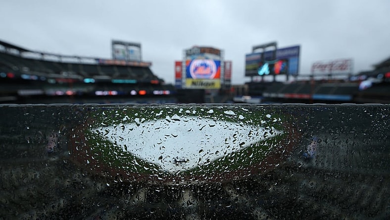 May 30, 2021; New York City, New York, USA; General view of a tarp on the field as rain falls at Citi Field. Tonight's game between the New York Mets and the Atlanta Braves has been postponed due to inclement weather. Mandatory Credit: Brad Penner-USA TODAY Sports