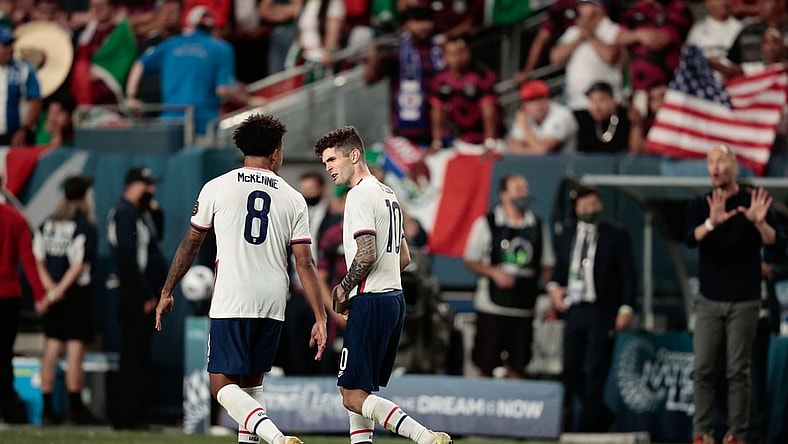 Jun 6, 2021; Denver, Colorado, USA; United States forward Christian Pulisic (10) celebrates with midfielder Weston Mckennie (8) after converting a penalty kick in extra time against Mexico during the 2021 CONCACAF Nations League Finals soccer series final match at Empower Field at Mile High. Mandatory Credit: Isaiah J. Downing-USA TODAY Sports