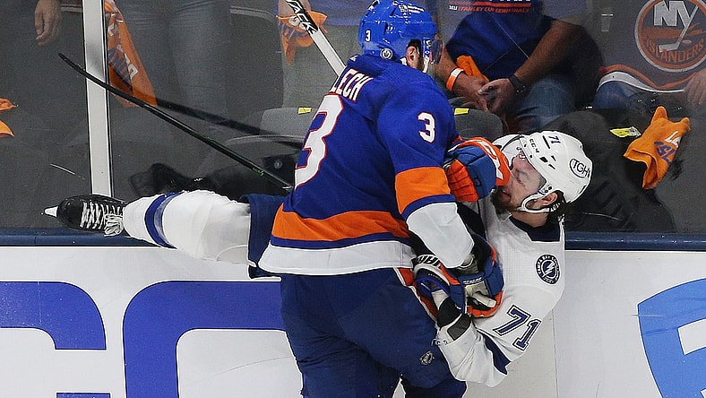 Jun 23, 2021; Uniondale, New York, USA; Tampa Bay Lightning center Anthony Cirelli (71) is checked by New York Islanders defenseman Adam Pelech (3) during the third period in game six of the 2021 Stanley Cup Semifinals at Nassau Veterans Memorial Coliseum. Mandatory Credit: Andy Marlin-USA TODAY Sports