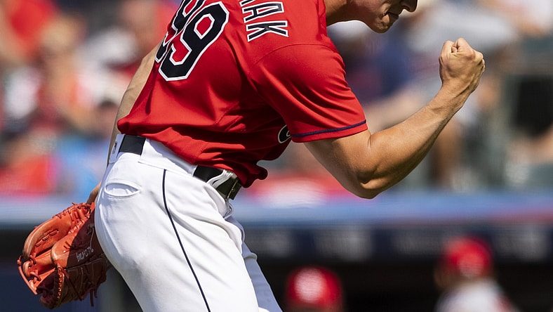 Jul 28, 2021; Cleveland, Ohio, USA; Cleveland Indians pitcher James Karinchak (99) pump his fist following the final out against the Cleveland Indians at Progressive Field. Mandatory Credit: Scott Galvin-USA TODAY Sports