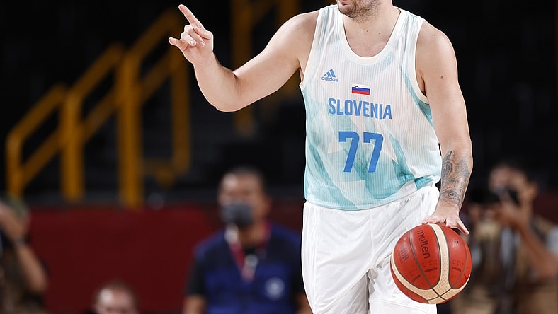 Jul 29, 2021; Saitama, Japan; Slovenia player Luka Doncic (77) dribbles while playing Japan during the Tokyo 2020 Olympic Summer Games at Saitama Super Arena. Mandatory Credit: Yukihito Taguchi-USA TODAY Sports