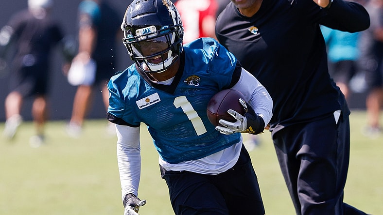 Jul 29, 2021; Jacksonville, FL, USA;  Jacksonville Jaguars running back Travis Etienne (1) participates in training camp at Dream Finders Homes practice field Mandatory Credit: Nathan Ray Seebeck-USA TODAY Sports