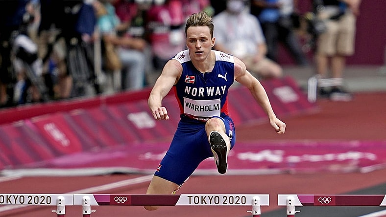 Jul 30, 2021; Tokyo, Japan; Karsten Warholm (NOR) competes in the men's 400m hurdles round 1 heat 3 during the Tokyo 2020 Olympic Summer Games at Olympic Stadium. Mandatory Credit: Andrew Nelles-USA TODAY Sports