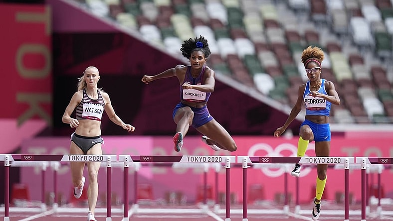 Jul 31, 2021; Tokyo, Japan; From left Sage Watson (CAN), Anna Cockrell (USA) and Yadisleidis Pedroso (ITA) race in the women's 400m hurdles round 1 during the Tokyo 2020 Olympic Summer Games at Olympic Stadium. Mandatory Credit: James Lang-USA TODAY Sports