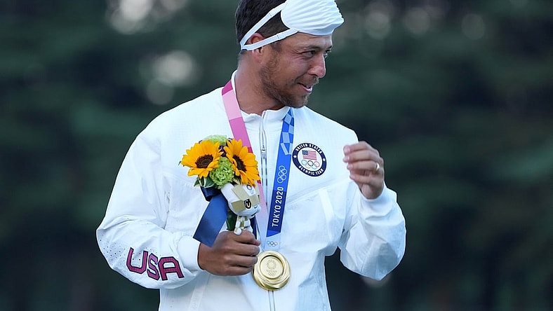 Aug 1, 2021; Tokyo, Japan; Xander Schauffele (USA) celebrates on the podium after winning the gold medal during the final round of the men's individual stroke play of the Tokyo 2020 Olympic Summer Games at Kasumigaseki Country Club. Mandatory Credit: Kyle Terada-USA TODAY Sports