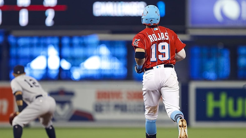 Aug 1, 2021; Miami, Florida, USA; Miami Marlins shortstop Miguel Rojas (19) runs toward second base for a double during the first inning of the game against the New York Yankees at loanDepot Park. Mandatory Credit: Sam Navarro-USA TODAY Sports