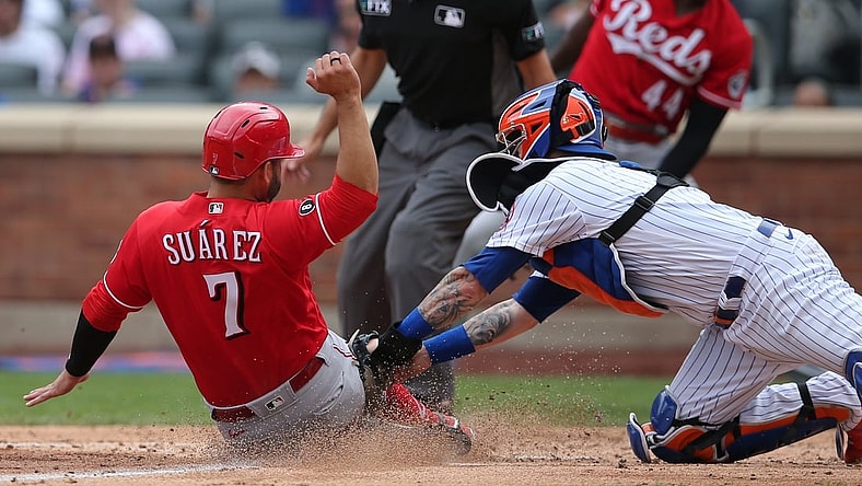Aug 1, 2021; New York City, New York, USA; Cincinnati Reds third baseman Eugenio Suarez (7) is tagged out at home by New York Mets catcher Tomas Nido (3) while trying to score on a hit by Cincinnati Reds center fielder Tyler Naquin (not pictured) during the fourth inning at Citi Field. Mandatory Credit: Brad Penner-USA TODAY Sports