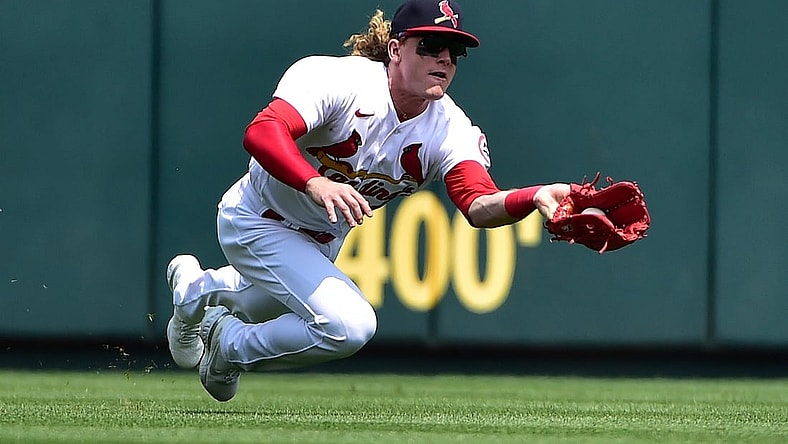 Aug 1, 2021; St. Louis, Missouri, USA;  St. Louis Cardinals center fielder Harrison Bader (48) dives and catches a ball hit by Minnesota Twins third baseman Luis Arraez (not pictured) during the fourth inning at Busch Stadium. Mandatory Credit: Jeff Curry-USA TODAY Sports