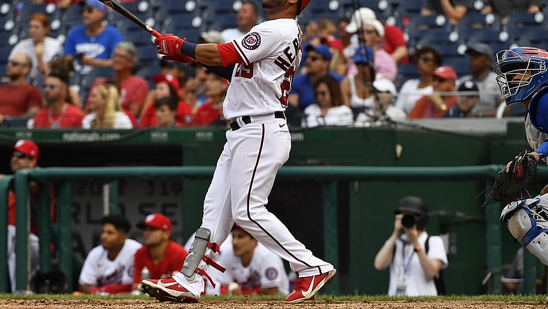 Aug 1, 2021; Washington, District of Columbia, USA; Washington Nationals left fielder Yadiel Hernandez (29) watches his walk off home run against the Chicago Cubs during the ninth inning at Nationals Park. Mandatory Credit: Brad Mills-USA TODAY Sports