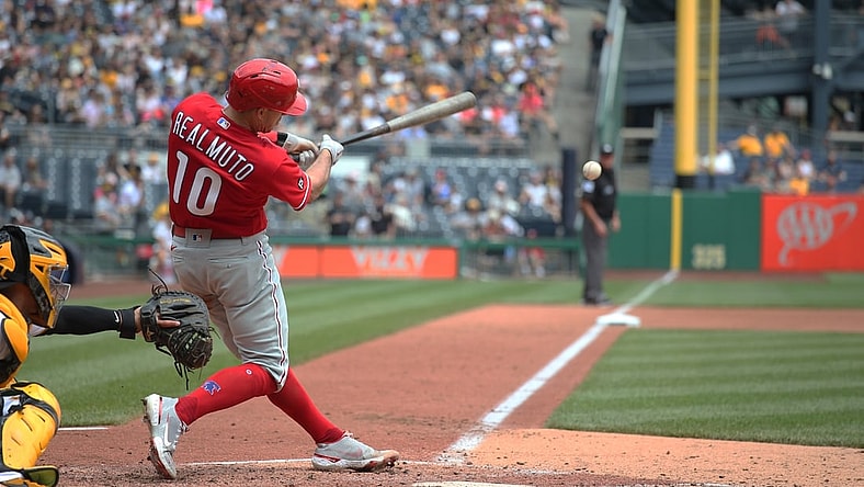Aug 1, 2021; Pittsburgh, Pennsylvania, USA; Philadelphia Phillies catcher J.T. Realmuto (10) hits an RBI double against the Pittsburgh Pirates during the fifth inning at PNC Park. Mandatory Credit: Charles LeClaire-USA TODAY Sports