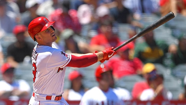 Aug 1, 2021; Anaheim, California, USA; Los Angeles Angels catcher Max Stassi (33) hits a two run home run in the first inning of the game against the Oakland Athletics at Angel Stadium. Mandatory Credit: Jayne Kamin-Oncea-USA TODAY Sports