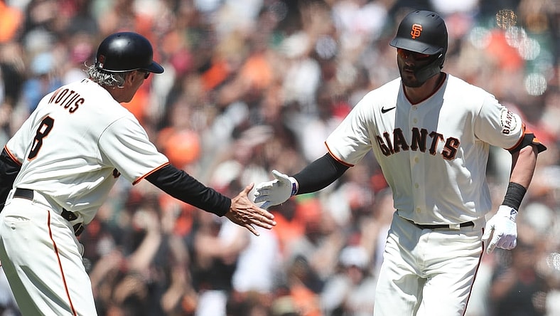 Aug 1, 2021; San Francisco, California, USA; San Francisco Giants third baseman Kris Bryant (23) celebrates with third base coach Ron Wotus (8) after hitting a home run during the third inning against the Houston Astros at Oracle Park. Mandatory Credit: Sergio Estrada-USA TODAY Sports