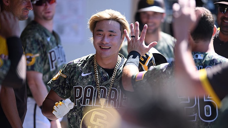 Aug 1, 2021; San Diego, California, USA; San Diego Padres shortstop Ha-seong Kim (7) is congratulated in the dugout after hitting a home run against the Colorado Rockies during the sixth inning at Petco Park. Mandatory Credit: Orlando Ramirez-USA TODAY Sports