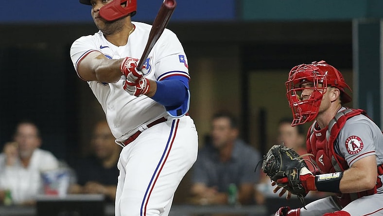 Aug 2, 2021; Arlington, Texas, USA; Texas Rangers designated hitter Curtis Terry (83) hits a double for his first major league hit in the second inning against the Los Angeles Angels at Globe Life Field. Mandatory Credit: Tim Heitman-USA TODAY Sports