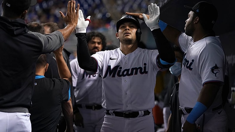 Aug 2, 2021; Miami, Florida, USA; Miami Marlins catcher Alex Jackson (23) celebrates in the dugout with teammates after hitting a solo homerun in the 2nd inning against the New York Mets at loanDepot park. Mandatory Credit: Jasen Vinlove-USA TODAY Sports
