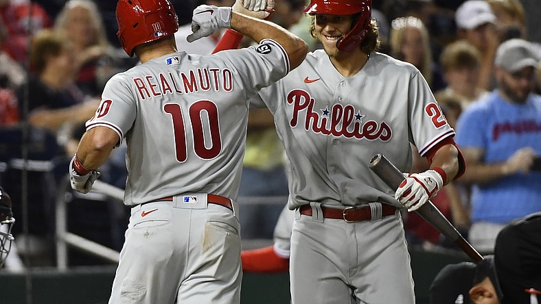 Aug 3, 2021; Washington, District of Columbia, USA; Philadelphia Phillies catcher J.T. Realmuto (10) celebrates with third baseman Alec Bohm (28) after hitting a home run against the Washington Nationals during the seventh inning at Nationals Park. Mandatory Credit: Brad Mills-USA TODAY Sports