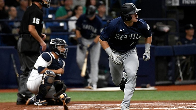 Aug 3, 2021; St. Petersburg, Florida, USA; Seattle Mariners center fielder Jarred Kelenic (10) hits a solo home run against the Tampa Bay Rays in the fourth inning at Tropicana Field. Mandatory Credit: Jonathan Dyer-USA TODAY Sports