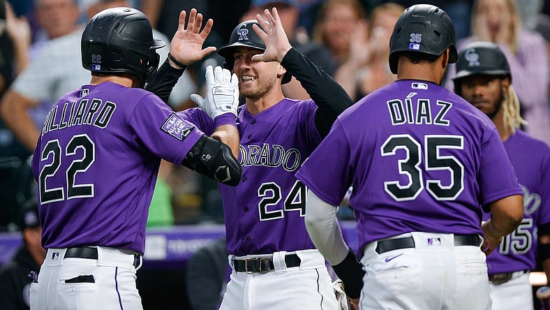 Aug 3, 2021; Denver, Colorado, USA; Colorado Rockies center fielder Sam Hilliard (22) celebrates with third baseman Ryan McMahon (24) and catcher Elias Diaz (35) after hitting a three run home run against the Chicago Cubs in the fourth inning at Coors Field. Mandatory Credit: Isaiah J. Downing-USA TODAY Sports