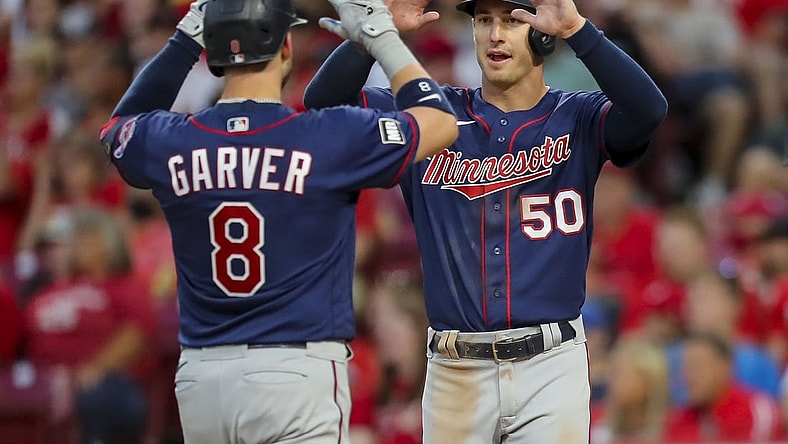 Aug 3, 2021; Cincinnati, Ohio, USA; Minnesota Twins catcher Mitch Garver (8) high fives left fielder Brent Rooker (50) after scoring a three run homer against the Cincinnati Reds during the fifth inning at Great American Ball Park. Mandatory Credit: Katie Stratman-USA TODAY Sports