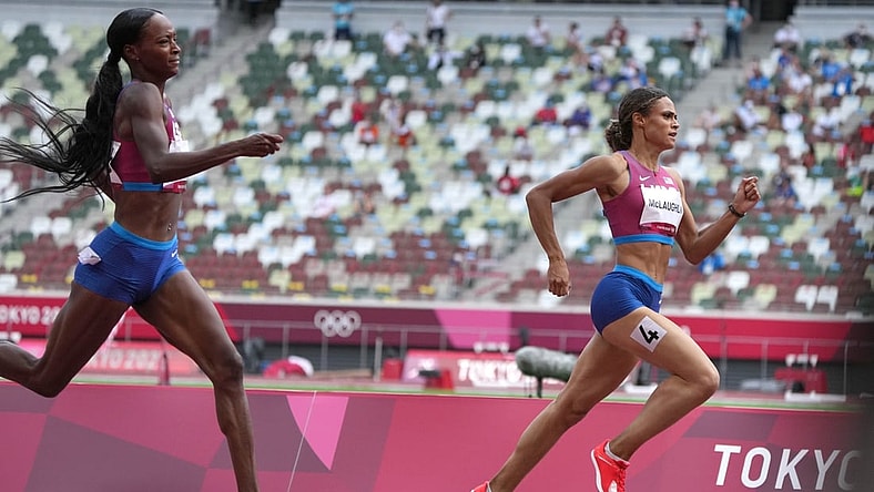 Aug 4, 2021; Tokyo, Japan; Sydney McLaughlin (USA), right, defeats Dalilah Muhammad (USA) to win the women's 400m hurdles n a world record 51.46 to 51.58 during the Tokyo 2020 Olympic Summer Games at Olympic Stadium. Mandatory Credit: Kirby Lee-USA TODAY Sports