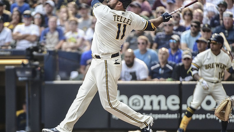 Aug 4, 2021; Milwaukee, Wisconsin, USA; Milwaukee Brewers first baseman Rowdy Tellez (11) hits a three-run home run in the seventh inning against the Pittsburgh Pirates at American Family Field. Mandatory Credit: Benny Sieu-USA TODAY Sports