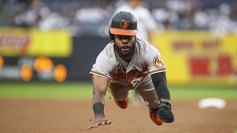 Aug 4, 2021; Bronx, New York, USA; Baltimore Orioles center fielder Cedric Mullins (31) slides into third base in the first inning against the New York Yankees at Yankee Stadium. Mandatory Credit: Wendell Cruz-USA TODAY Sports