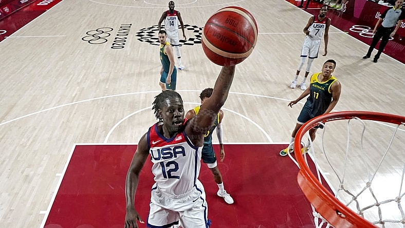 Aug 5, 2021; Saitama, Japan; United States guard Jrue Holiday (12) dunks the ball against Australia in the men's basketball semi final during the Tokyo 2020 Olympic Summer Games at Saitama Super Arena. Mandatory Credit: Kyle Terada-USA TODAY Sports