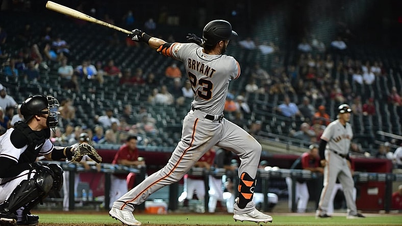 Aug 5, 2021; Phoenix, Arizona, USA; San Francisco Giants third baseman Kris Bryant (23) hits an RBI double in the  tenth inning against the Arizona Diamondbacks at Chase Field. Mandatory Credit: Matt Kartozian-USA TODAY Sports