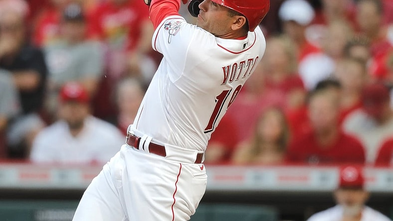 Aug 5, 2021; Cincinnati, Ohio, USA; Cincinnati Reds first baseman Joey Votto (19) hits a three-run home run against the Pittsburgh Pirates during the second inning at Great American Ball Park. Mandatory Credit: David Kohl-USA TODAY Sports