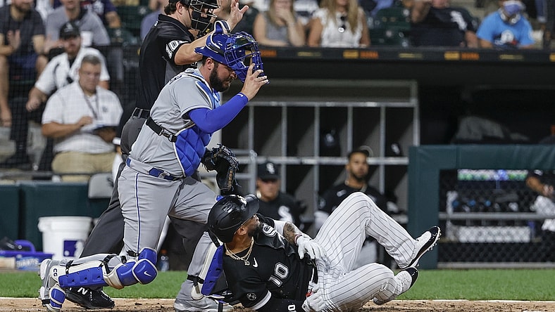 Aug 5, 2021; Chicago, Illinois, USA; Chicago White Sox third baseman Yoan Moncada (10) is hit by a pitch from Kansas City Royals starting pitcher Daniel Lynch (not pictured) during the fourth inning at Guaranteed Rate Field. Mandatory Credit: Kamil Krzaczynski-USA TODAY Sports
