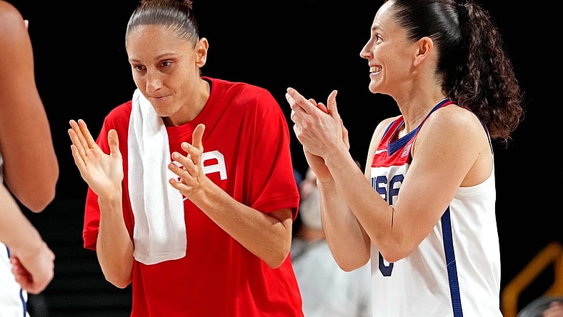Aug 6, 2021; Saitama, Japan; Team United States guard Diana Taurasi (12) and guard Sue Bird (6) reacts after beating Serbia in the women's basketball semi-final during the Tokyo 2020 Olympic Summer Games at Saitama Super Arena. Mandatory Credit: Kyle Terada-USA TODAY Sports