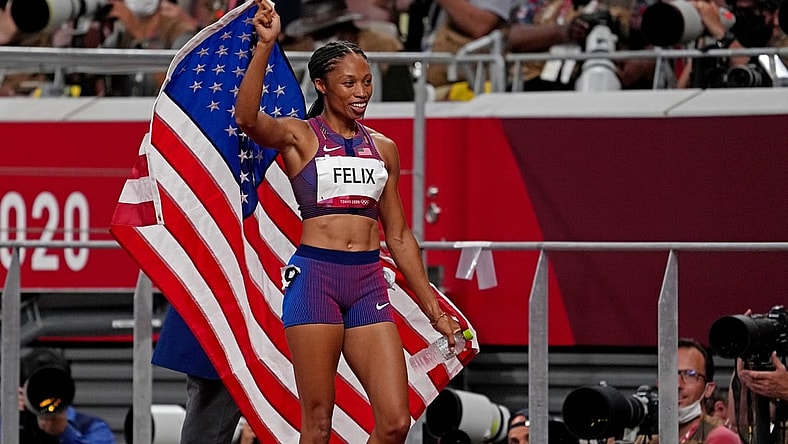 Aug 6, 2021; Tokyo, Japan; Allyson Felix (USA) celebrates winning the bronze medal in the women's 400m final during the Tokyo 2020 Olympic Summer Games at Olympic Stadium. Mandatory Credit: Kirby Lee-USA TODAY Sports