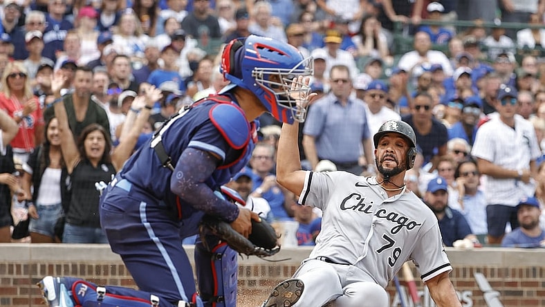 Aug 6, 2021; Chicago, Illinois, USA; Chicago White Sox first baseman Jose Abreu (79) scores against the Chicago Cubs during the fourth inning at Wrigley Field. Mandatory Credit: Kamil Krzaczynski-USA TODAY Sports