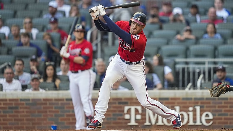 Aug 6, 2021; Cumberland, Georgia, USA; Atlanta Braves first baseman Freddie Freeman (5) singles down the third base line prior to scoring against the Washington Nationals during the first inning at Truist Park. Mandatory Credit: Dale Zanine-USA TODAY Sports