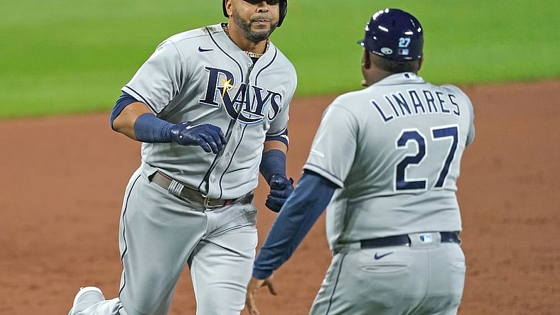 Aug 6, 2021; Baltimore, Maryland, USA; Tampa Bay Rays designated hitter Nelson Cruz (23) greeted by coach Rodney Linares (27) after his three run home run in the sixth inning against the Baltimore Orioles at Oriole Park at Camden Yards. Mandatory Credit: Mitch Stringer-USA TODAY Sports