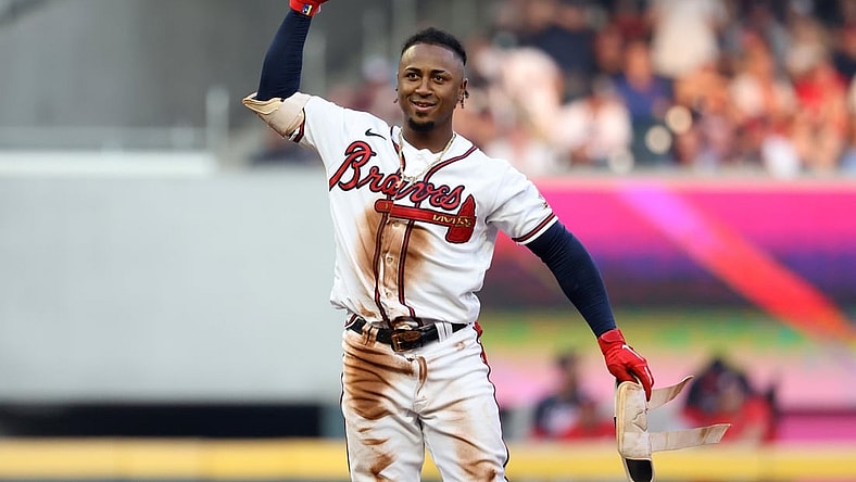 Aug 7, 2021; Atlanta, Georgia, USA; Atlanta Braves second baseman Ozzie Albies (1) reacts after hitting a double during the third inning against the Washington Nationals at Truist Park. Mandatory Credit: Jason Getz-USA TODAY Sports