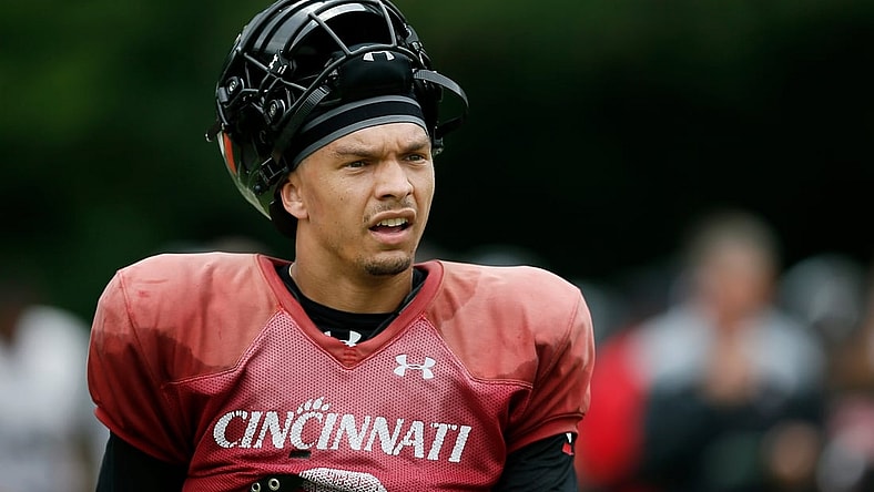 Cincinnati Bearcats quarterback Desmond Ridder (9) resets between plays during practice at the Higher Ground training facility in West Harrison, Ind., on Monday, Aug. 9, 2021.

Cincinnati Bearcats Football Camp