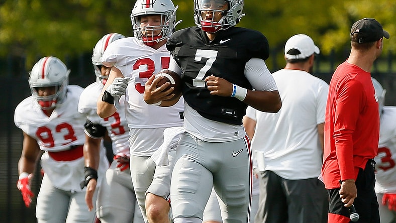 Ohio State Buckeyes quarterback C.J. Stroud (7) jogs during warm-ups for football training camp at the Woody Hayes Athletic Center in Columbus on Tuesday, Aug. 10, 2021.

Ohio State Football Training Camp