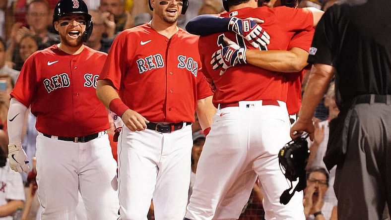Aug 10, 2021; Boston, Massachusetts, USA; Boston Red Sox right fielder Hunter Renfroe (10) gets a hug from shortstop Xander Bogaerts (2) after hitting a three run home run against the Tampa Bay Rays during the fourth inning at Fenway Park. Mandatory Credit: David Butler II-USA TODAY Sports