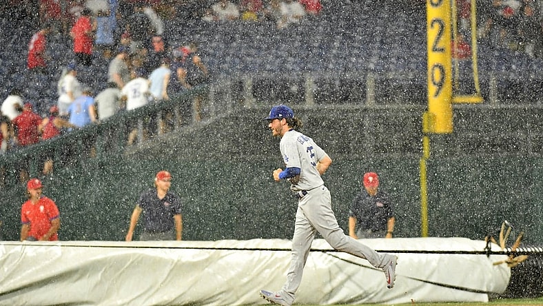 Aug 10, 2021; Philadelphia, Pennsylvania, USA; Los Angeles Dodgers center fielder Cody Bellinger (35) runs off the field during rain delay in the fourth inning against the Philadelphia Phillies at Citizens Bank Park. Mandatory Credit: Eric Hartline-USA TODAY Sports