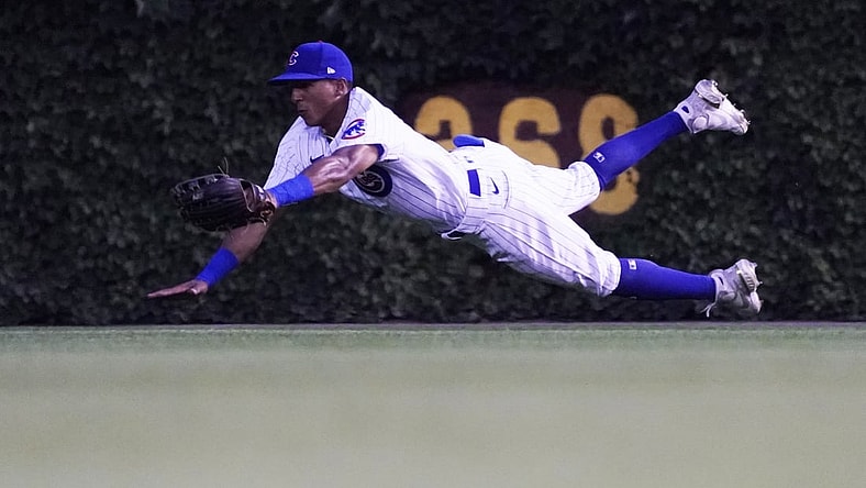 Aug 10, 2021; Chicago, Illinois, USA; Chicago Cubs center fielder Johneshwy Fargas (4) makes a catch on Milwaukee Brewers first baseman Rowdy Tellez (not pictured) during the second inning at Wrigley Field. Mandatory Credit: David Banks-USA TODAY Sports
