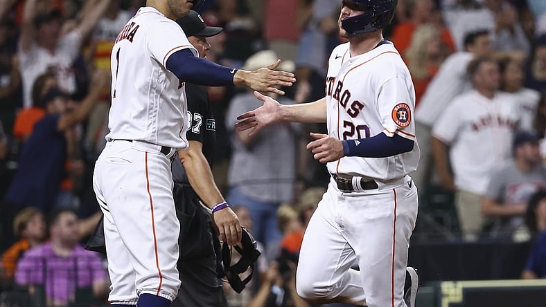 Aug 10, 2021; Houston, Texas, USA; Houston Astros center fielder Chas McCormick (20) celebrates with shortstop Carlos Correa (1) after scoring a run against the Colorado Rockies during the fourth inning at Minute Maid Park. Mandatory Credit: Troy Taormina-USA TODAY Sports