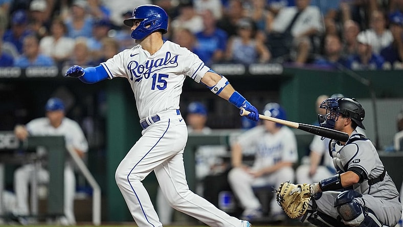 Aug 10, 2021; Kansas City, Missouri, USA; Kansas City Royals designated hitter Whit Merrifield (15) hits a double against the New York Yankees during the fifth inning at Kauffman Stadium. Mandatory Credit: Jay Biggerstaff-USA TODAY Sports
