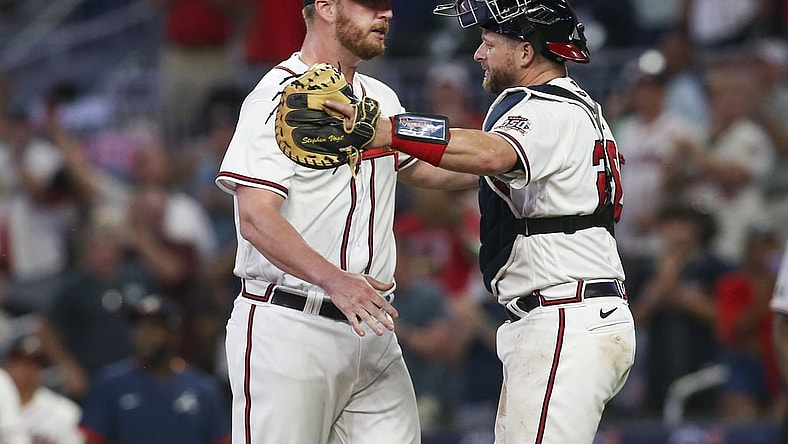 Aug 10, 2021; Atlanta, Georgia, USA; Atlanta Braves relief pitcher Will Smith (51) and catcher Stephen Vogt (26) celebrate after defeating the Cincinnati Reds at Truist Park. Mandatory Credit: Brett Davis-USA TODAY Sports